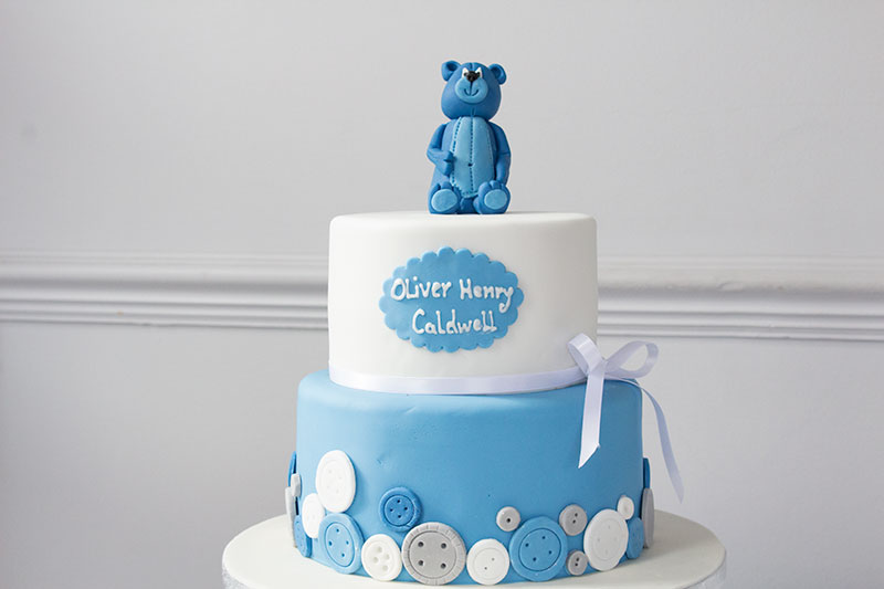 Two-Tier-Baby-Shower-Cake-with-Teddy-Bear-and-Buttons.jpg